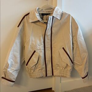 Lioness Cream Jacket with Brown Trim